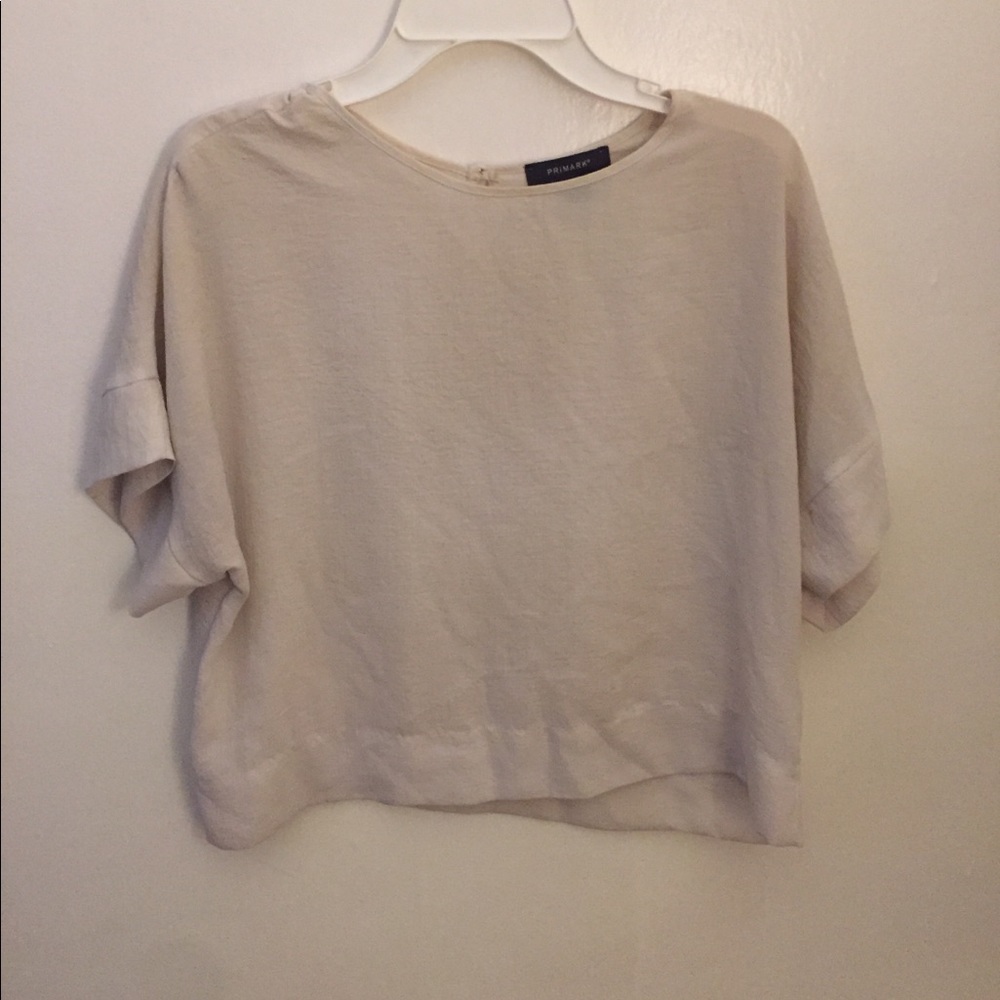 Cream blouse with button in back